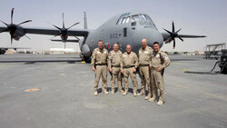 Major Shane Loder, right, was all smiles after completing his first successful operational
airdrop mission for Canada’s new fleet of CC130J aircraft. Loder and the rest of his crew, from
left: Captain Brad Beauchamp, Sergeant Les Page, MCpl. Andy Orr, Sergeant David Burrill
and Loder, were back safe to the Kandahar Airfield after the drop with their CC130J Hercules.
(Photo submitted)